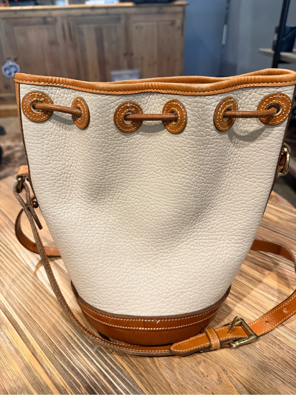 Vintage Dooney & Bourke Cream and Tan Leather Drawstring Crossbody Bucket Bag - Picture 2 of 5
